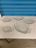 All five fish-shaped plates laid out on table