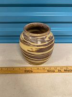 Front view of vase showing swirl glaze and size reference