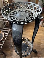 Top view showing pierced floral pattern and aged patina