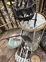 Full lot showing stand with additional decor items stacked