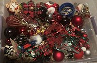 Top view of plastic bin filled with assorted ornaments