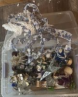 Overall view of tote with assorted ornaments and ribbons