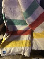 Blanket full view showing stripe pattern and Ayers label