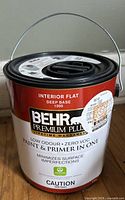 Front view of sealed Behr Premium Plus paint can showing label details