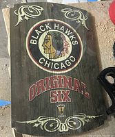 Front view of the wood wall sign showing entire graphic