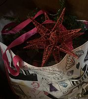 Red glitter star, greenery wreath and graphic tote bag overview