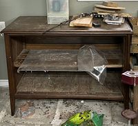 Front view of dark brown solid wood bookshelf console table