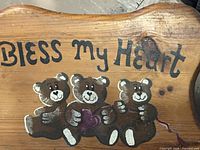 Top view of stool showing hand-painted bears and text