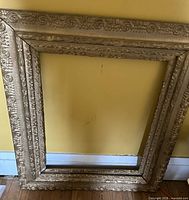 Front view of entire ornate gold frame