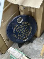 Full view of round Notre Dame logo table showing cup holders and legs
