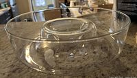 Overall view of clear etched chip-and-dip bowl on countertop
