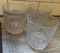 three clear cut crystal tumblers front view
