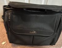 Front view showing Samsonite logo, front flap pocket and nylon material
