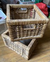 Two stacked square wicker/rattan baskets showing weave, handles and size