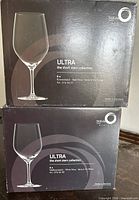 Front view of two boxed sets showing product images and branding