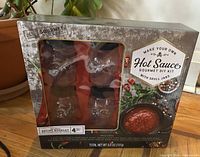 Front view of sealed The Modern Gourmet Hot Sauce DIY Kit box showing contents