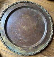 Top view of entire tray showing patinated surface and ornate rim