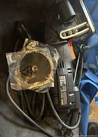 Top view of Worx circular saw with cord and spare blade pouch