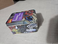 Spider-Man candy tin side view showing wrap and character graphics