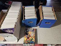 Three boxes of bagged and boarded comics plus sample issues Valor and Lucky Devil
