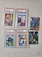 overview of all four PSA-slabbed cards