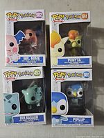 Front view of four boxed Funko Pop! Pokémon figures