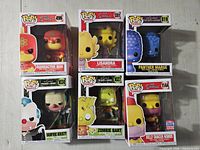 Six boxed Funko Pop! Simpsons figures arranged in two rows