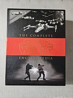 Front of slipcase showing title graphics