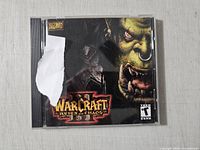 Front view of jewel case showing torn cover art and title