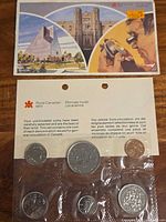Full view of sealed six-coin set with insert card