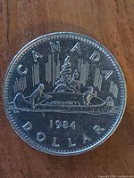 Reverse showing Voyageur canoe design and 1984 date