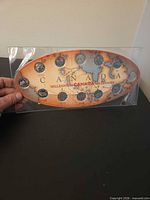 Front view of complete coin set in display sleeve