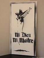 Full view of the artwork showing winged rat and text