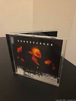 Front view of jewel case showing Soundgarden Superunknown cover