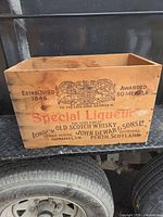 Front view showing main John Dewar & Sons branding and Special Liqueur graphics