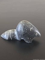 Left side view of the soapstone beaver showing form and incised tail