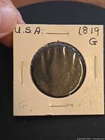 Obverse of 1819 large cent in holder