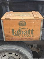 Front view of John Labatt Classic wooden crate on truck bed