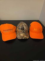 All three caps front view showing colors and designs