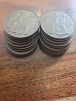 Two stacks of 1960s Great Britain One Penny coins