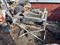 Overall view of tile saw on folding stand with accessories installed