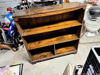 Front view showing three shelves and two bottom compartments of the bookcase