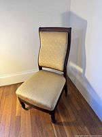 Front view of upholstered mahogany side chair