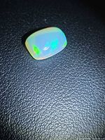 Rectangular cushion Ethiopian opal showing green and red flashes