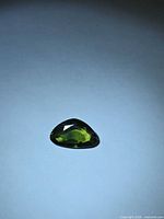 Top view of trillion-cut green sapphire
