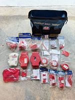 Full lot overview showing Brady carry bag and sealed lockout devices