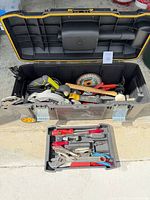 Overall shot of open DeWalt rolling toolbox and removable tray showing power tools and hand tools