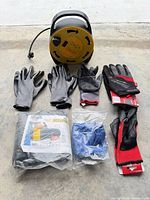 Lot overview: cord reel and six glove pairs