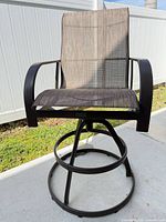 Front view of Winston swivel bar stool showing seat, arms, footrest