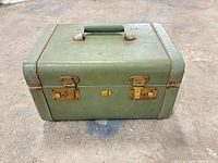 front view closed suitcase showing latches, lock and handle